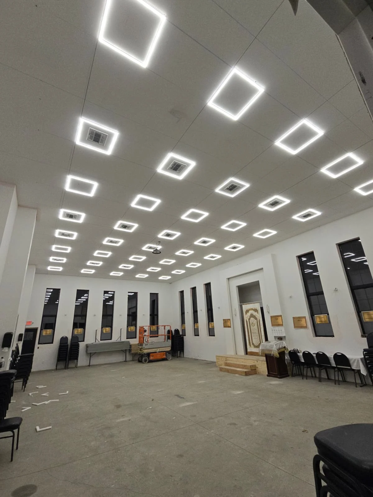 Commercial hall with rows of square LED ceiling lights