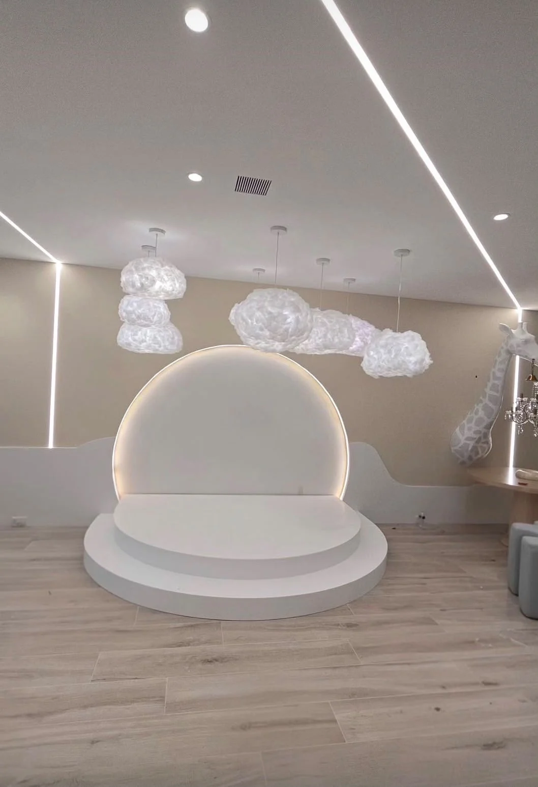 Custom interior with linear lighting and sculptural fixtures