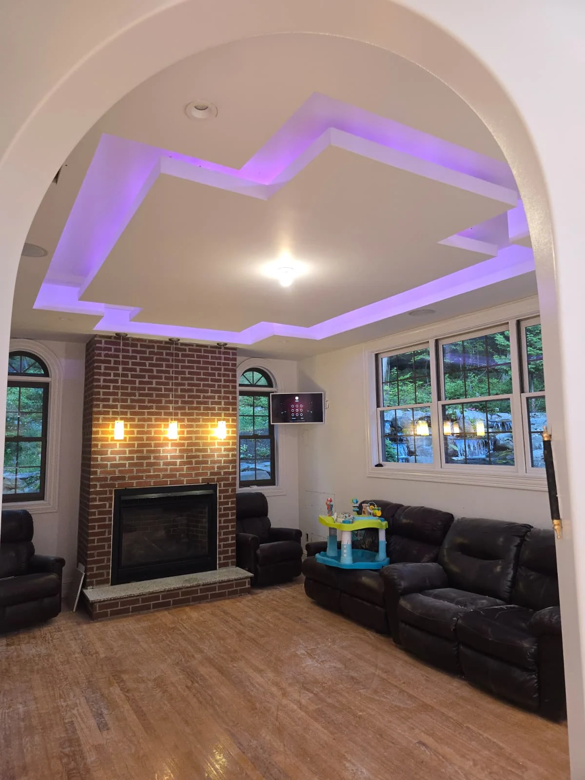 Living room with purple color-changing cove lighting